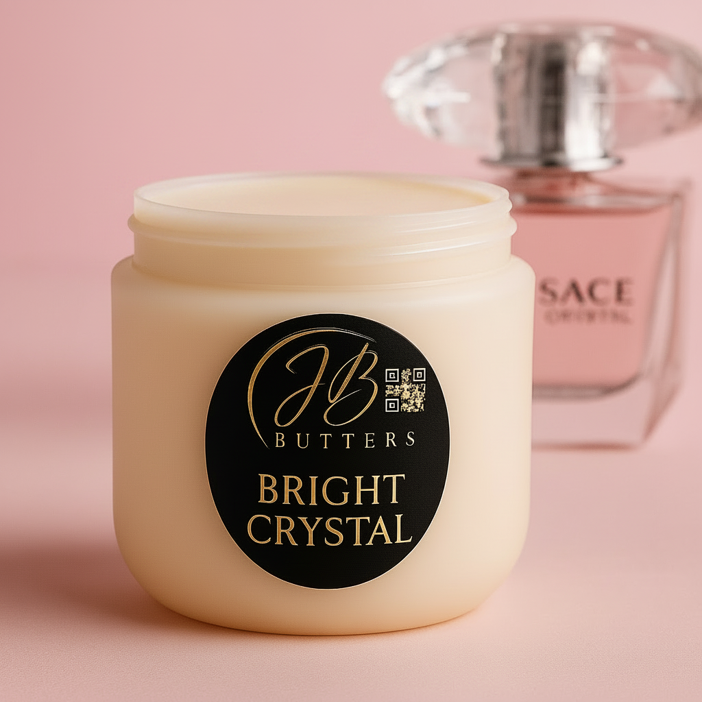 Jar of JB Butters Bright Crystal cream with a perfume bottle in the background on a pink background