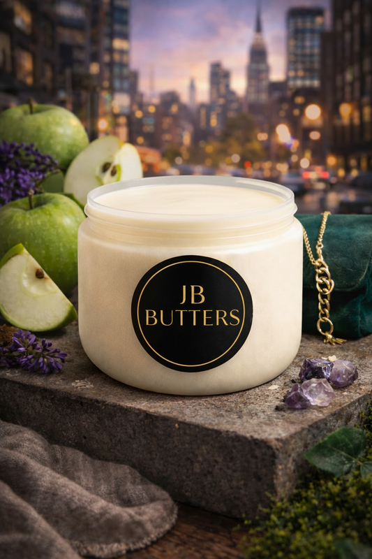 Jar of JB Butters cream with a cityscape in the background