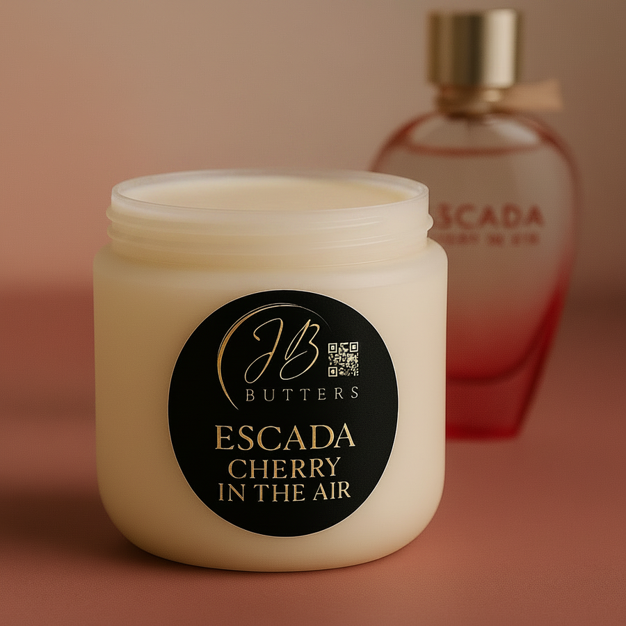Jar of Butters Escada Cherry in the Air cream with a blurred perfume bottle in the background.