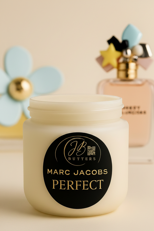 Jar of Marc Jacobs Perfect cream with a blurred perfume bottle in the background