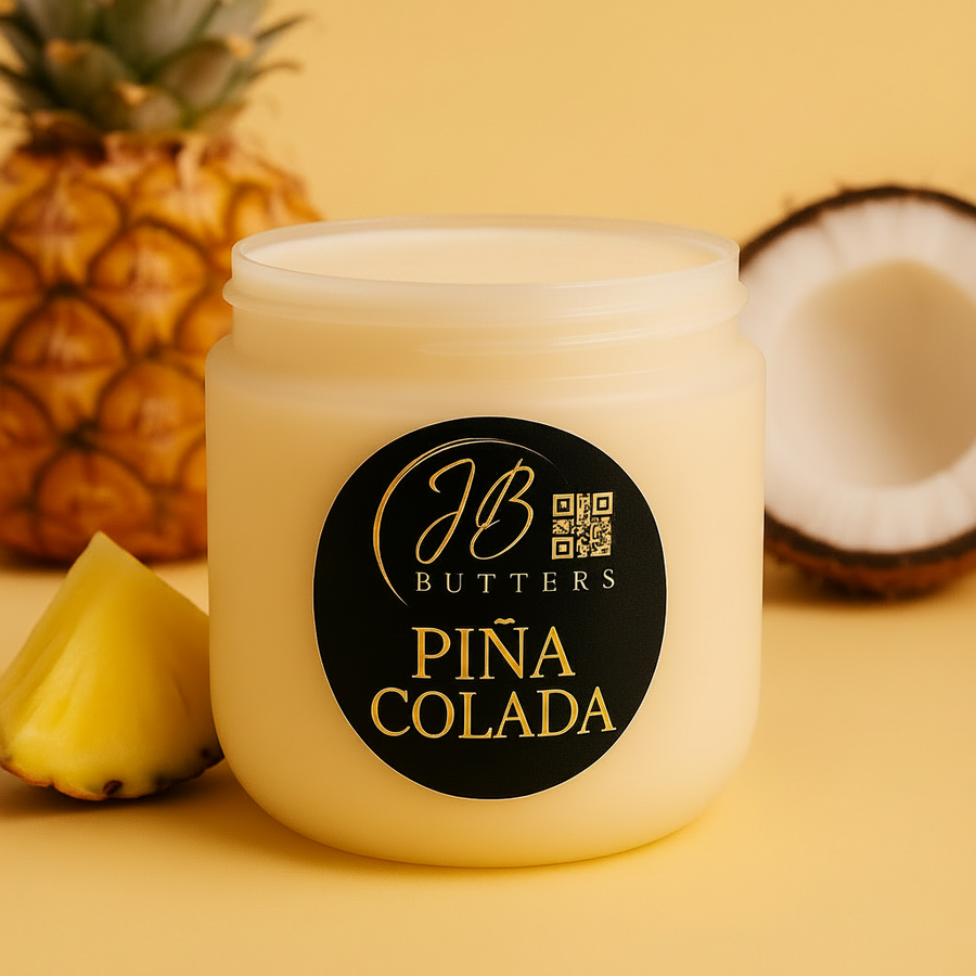 Jar of JB Butters Pina Colada on a yellow background with pineapple and coconut.